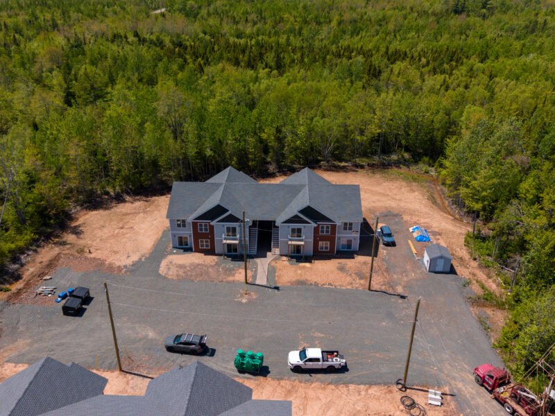 Two-storey apartment building and paved parking lot at Creamery Landing, Tatamagouche