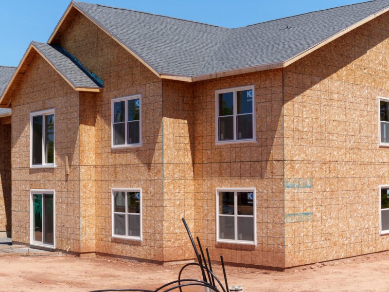 Wall sheathing, windows and shingled roof on a Creamery Landing apartment building