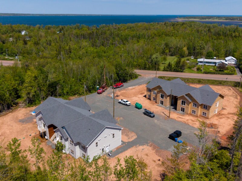 Drone view of Creamery Landing apartment buildings looking toward Tatamagouche Bay