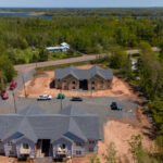 Aerial view of the Creamery Landing multi-unit buildings in Tatamagouche, NS, with Tatamagouche Bay behind