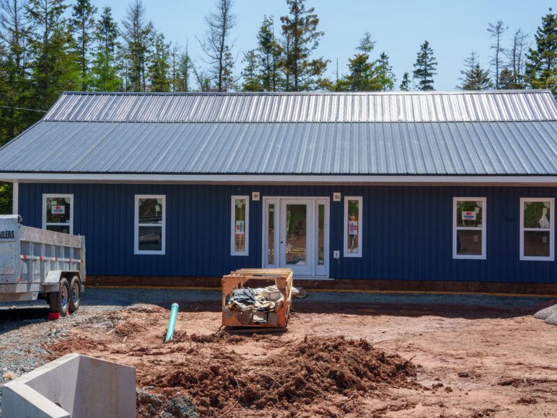 Glass entry door with sidelites on a new navy home in East Mountain, NS