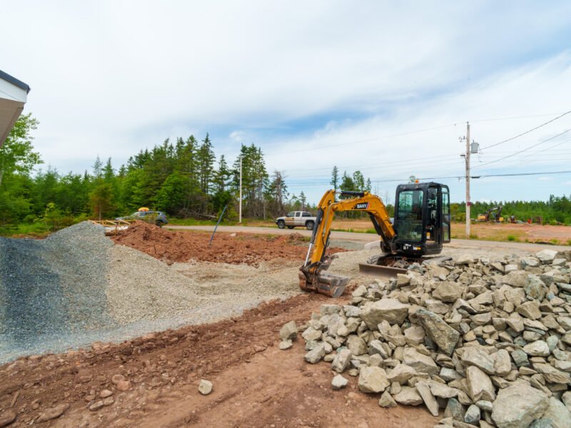 Mini excavator, gravel and stone at the East Mountain home site