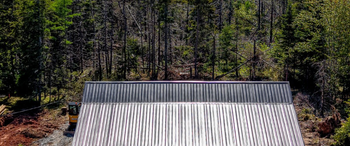 Overhead drone photo of a new home build on a treed lot in East Mountain, NS