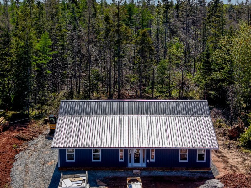 Overhead drone photo of a new home build on a treed lot in East Mountain, NS