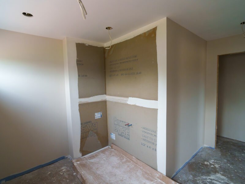 Shower area with cement board ready for tile in a new home near Truro