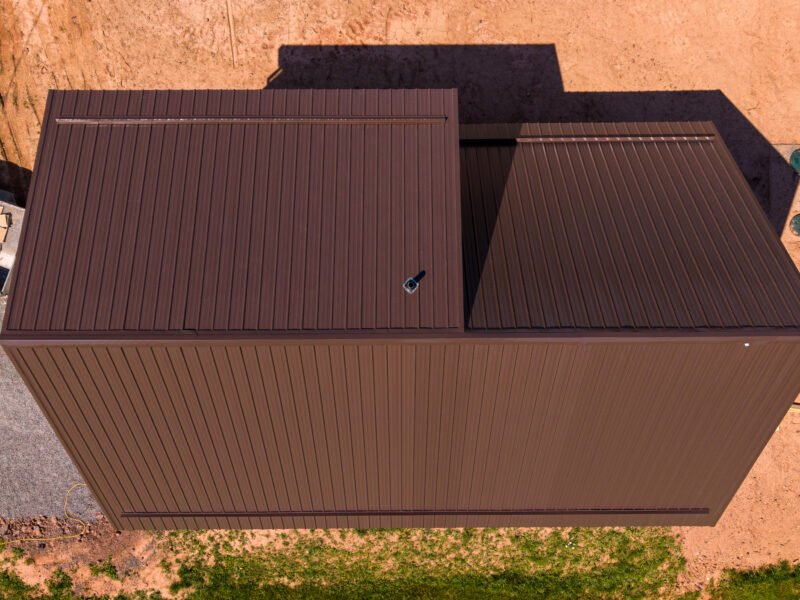Overhead drone view of a new home's brown steel roof in Bayhead, near Tatamagouche
